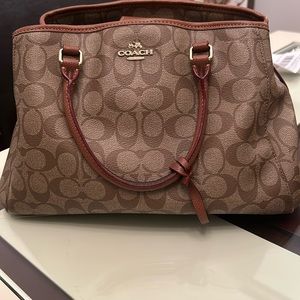 Coach leather hand bag in pre-loved condition.